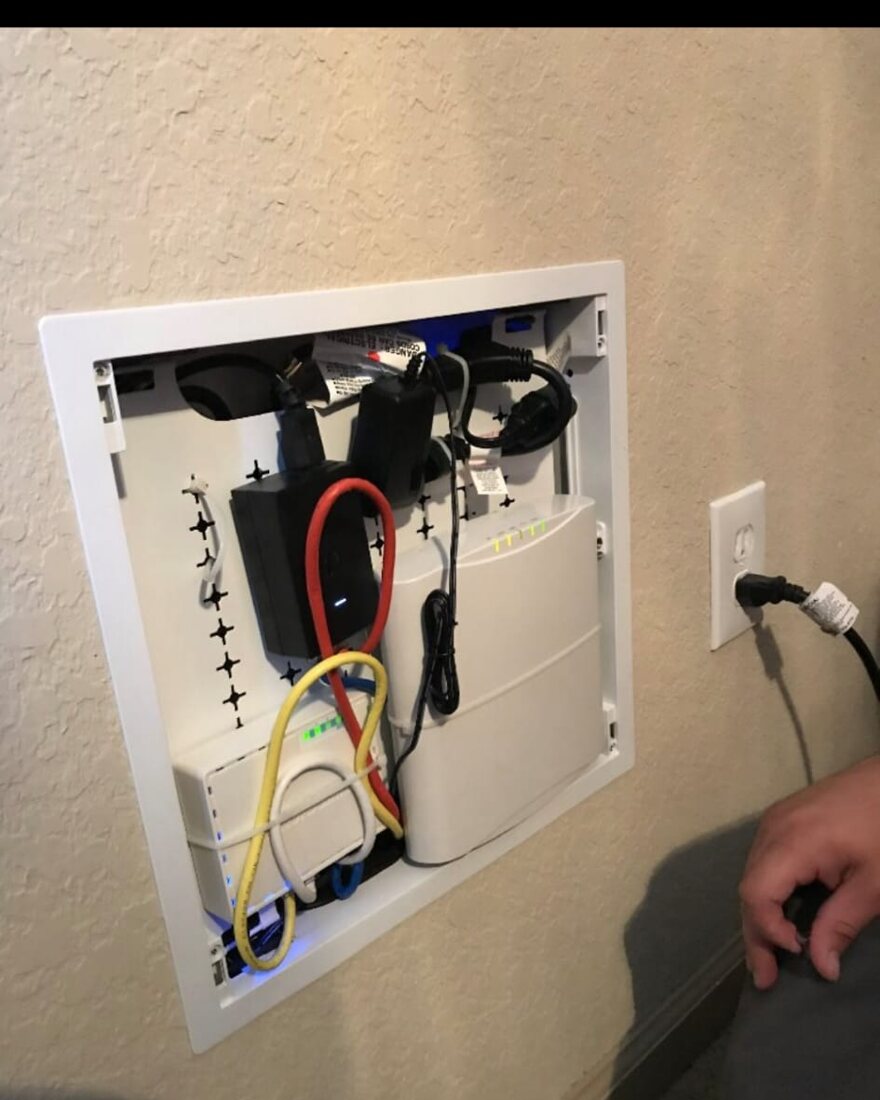 Clean, organized low-voltage cabling installation in progress with professional tools